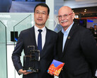 A Huawei representative accepts the award from John Hoffman, the CEO of GSMA. (Source: Huawei)