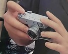 Hands-on image of the Fujifilm XHalf compact camera.