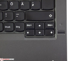 Closely attached vertical arrow keys.