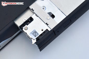 A small latch secures the module inside the notebook.