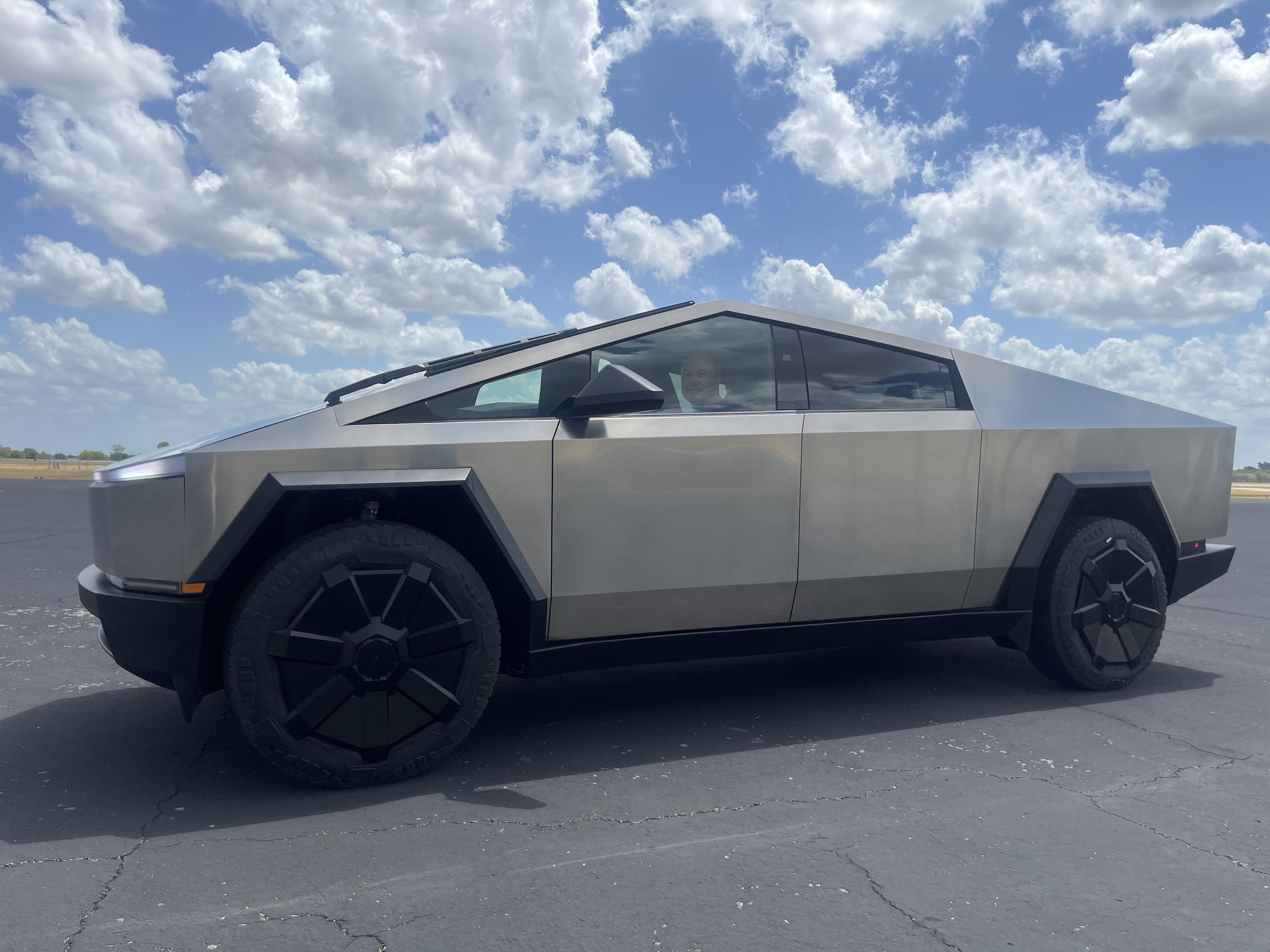 Elon Musk teases imperfect production Cybertruck as challenging delivery day event referral program goes live