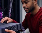 A person putting a Lenovo server rack in its place.