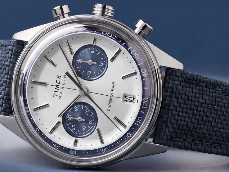 Timex Marlin Jet Chronograph photographed against a dark background, showing its domed crystal, tachymeter bezel, concave dial, chronograph subdials, and retro-futurist case design.