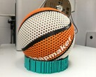 A decorative image showing a 3D printed basketball