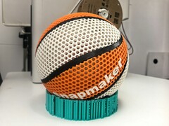 A decorative image showing a 3D printed basketball