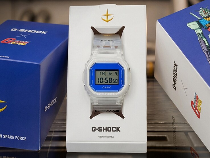 Casio G-Shock x Mobile Suit Gundam DW-5600 featuring a transparent case and band, blue bezel, E.F.S.F. branding, and collector packaging with Gundam artwork.