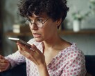 Woman speaking into a smartphone