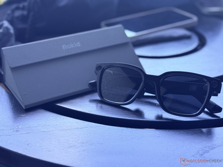The Rokid AI Glasses Style next to its foldable carrying case