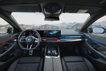 BMW has gone the same route as many EV manufacturers when it comes to UI and interior design. At least there are still steering wheel controls. (Image source: BMW)