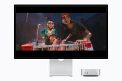 The image shows the new M6 Mac mini next to a Studio display. Some sort of a movie is being played