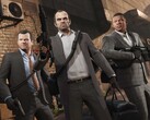 Grand Theft Auto V main characters Michael, Trevor, and Franklin in a heist mission with weapons and bags. (Image source: Rockstar Games)