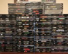 A collection of PlayStation 1 physical discs including boxes