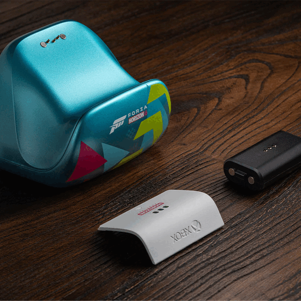 The 8BitDo charging dock comes with a spare battery and battery door.