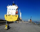 A moored container ship at a quay (Image source: Bruno Hervas via Unsplash)