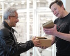 Jensen Huang hands Elon Musk one of the world's first Nvidia DGX Spark compact desktop computers designed for AI model development. (Image source: Nvidia)