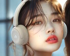 The JVC Kenwood HA-S60W headphones in beige weigh just 149g (5.3 oz.). A young woman wearing the beige model pictured. (Image source: JVC Kenwood)