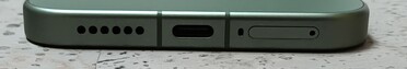 Bottom: Speaker, USB port, microphone, SIM slot