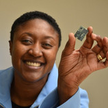 Exec of Intel's Communication and Devices division, Aicha Evans, holds up a modem. (Source: The Motley Fool)