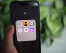 Smartphone showing an app folder named AI with ChatGPT, Mistral AI, Claude, Gemini, Copilot and Poe