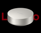 The Lenovo Yoga Mini i mini PC, pictured against a black background and the partially obscured Lenovo logo. (Image source: Lenovo - edited)