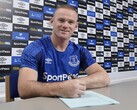 Waryne Rooney signing a document. (Image source: Official Wayne Rooney)