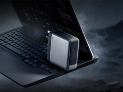 The 360W Cuktech laptop charger comes with a 5525 DC port. Pictured: a promo picture of the adapter with an laptop.