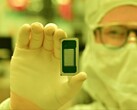 A latest-generation Intel processor of the Panther Lake family, held up by a factory worker. (Image source: Intel)