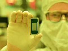 A latest-generation Intel processor of the Panther Lake family, held up by a factory worker. (Image source: Intel)