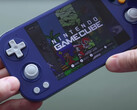 A hands-on shot of the Anbernic RG476H in its Gamecube-inspired colour option. (Image source: Retro Game Corps)
