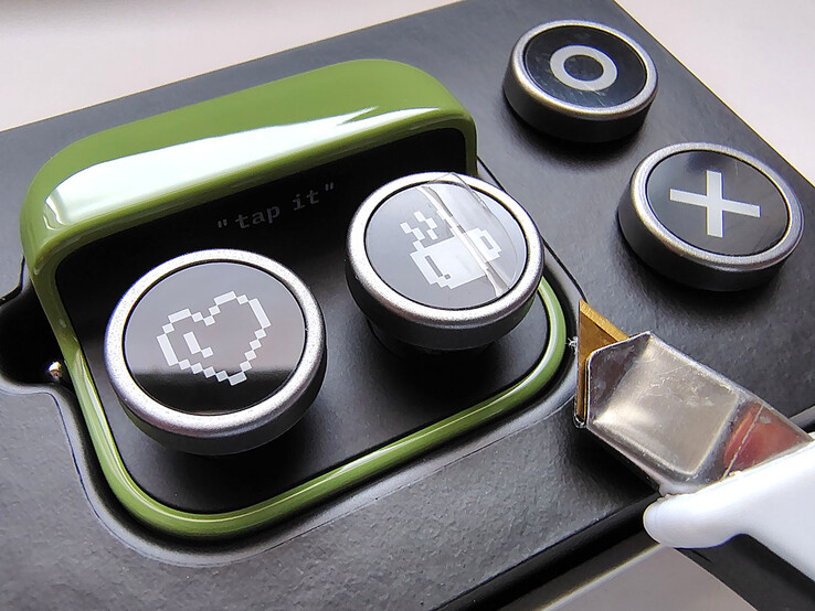 Removing button protector film.