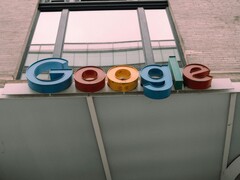 The Google logo displayed on a building facade. (Image source: Hardeep Singh via Pexels)