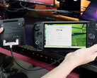 The external battery extension cable for Win 5 appears to be in an early stage now. Pictured: the accessory connected to the gaming handheld. (Image source: GPD)