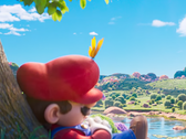 In a quiet moment before cosmic adventure, Mario naps beneath a technicolor tree—teasing the calm before the interstellar storm in The Super Mario Galaxy Movie.