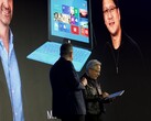 Huang accepts the Surface RT: Behind it is a photo of the presentation from 2012.