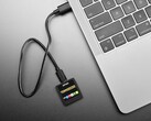 TermDriver 2 USB-to-serial adapter displaying real-time serial data on the built-in display