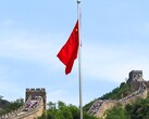The Chinese flag with the Great Wall of China in the background