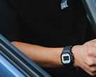 Person wearing the Casio G-Shock DW5600TT25-1 x Toyo Tires watch while seated inside a car.