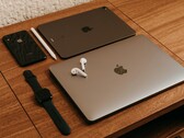 Decorative image. Pictured are two laptops and other consumer electronics laid out on a table (image source: Miguel Hernández via Unsplash; cropped)