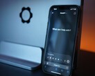 A smartphone with an AI chat interface that fits in one hand