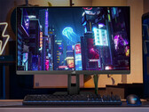 The refreshed ROG Strix XG27UCS can switch between 4K 160Hz and FHD 324Hz modes. Pictured: a promo picture showing a setup with the gaming monitor. (Image source: Asus)