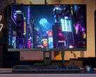 The refreshed ROG Strix XG27UCS can switch between 4K 160Hz and FHD 324Hz modes. Pictured: a promo picture showing a setup with the gaming monitor. (Image source: Asus)