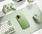 The OnePlus 15T is said to sport a 360° surround high-performance antenna setup. Pictured: the phone placed beside a mouse, controller, and keyboard.