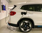 An electric car plugged in at a charging station (Image source: Eren Goldman via Unsplash)