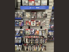 A GameStop aisle filled with physical PS3 games