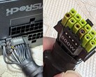 The burnt ASRock TempGuard power connector pictured with damage to PSU cables
