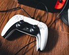 A picture of a PS5 controller next to a Nintendo Switch