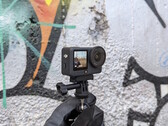 DJI Osmo Action 6 in front of a graffiti wall