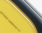 Close up of Nothing Headphone (a) in yellow.