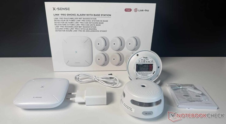 Contents of the X-Sense XS01-M (FS61) package—note that only two of the six smoke detectors are shown in the picture.