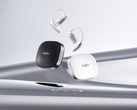 The Shokz OpenFit Pro (with case), pictured against a stylized silver background. (Image source: Shokz)